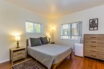 Master bedroom with charming touches. Relax in a cozy Queen size bed to recharge.